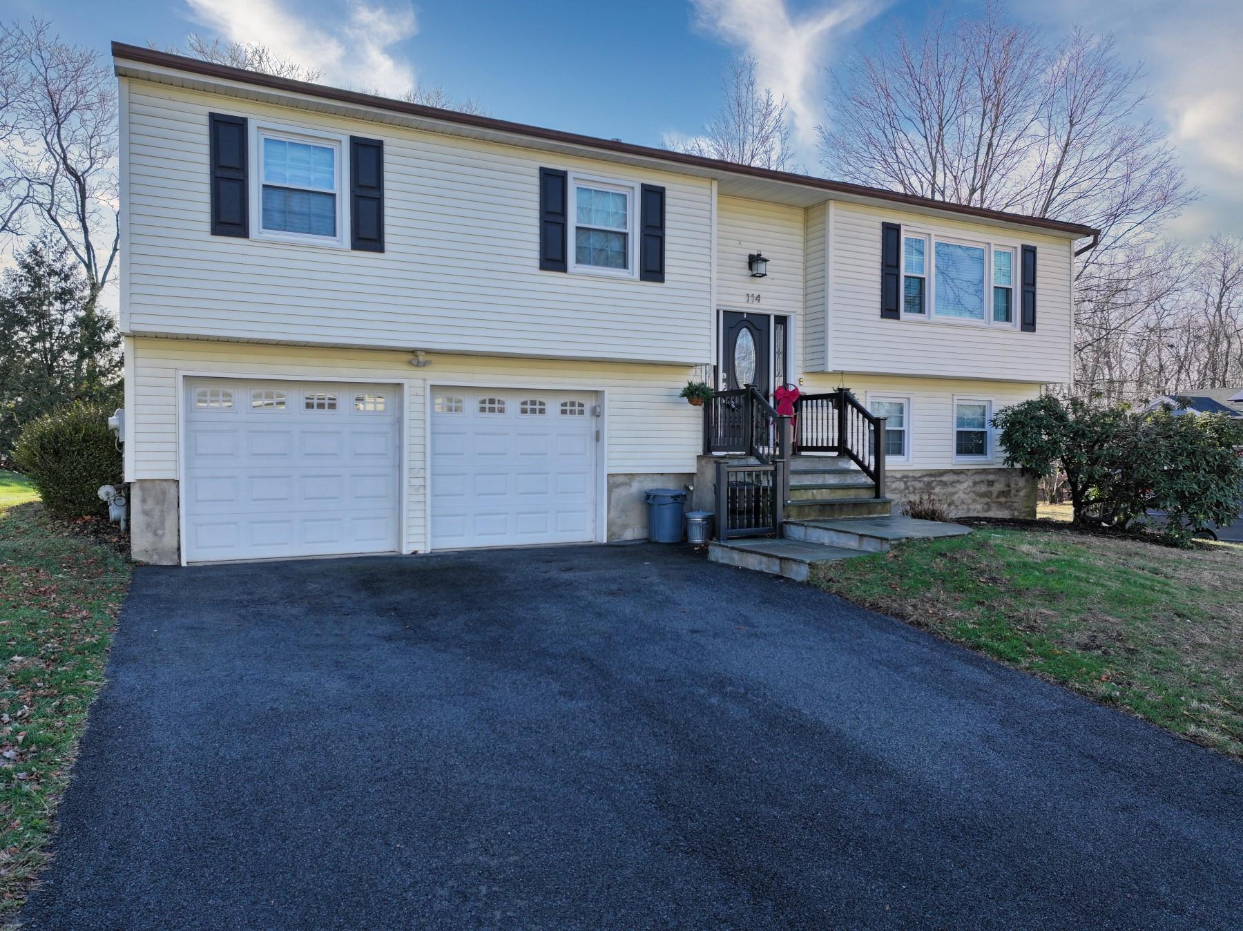 Raised ranch featuring a garage