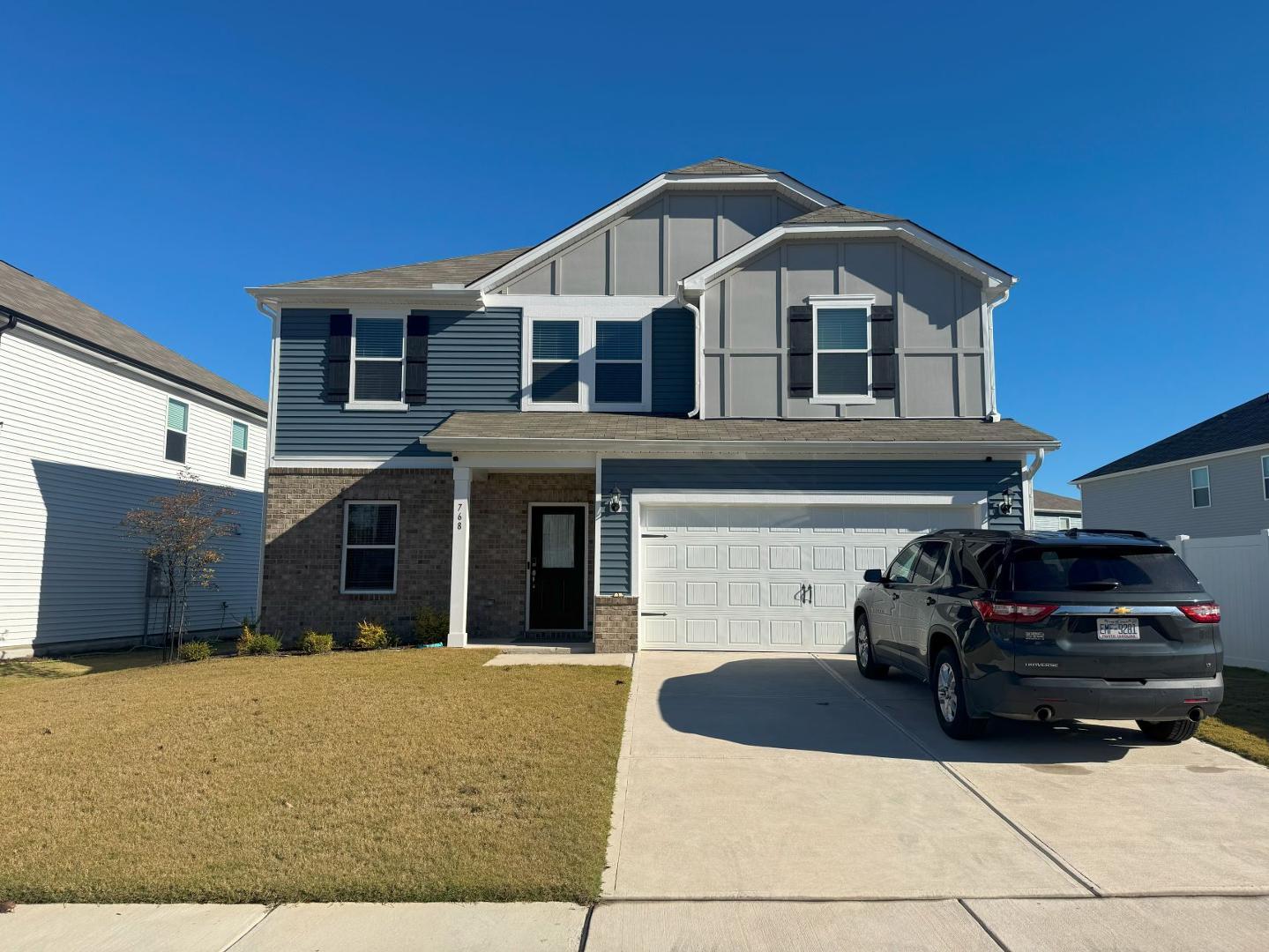 a front view of a house with garage