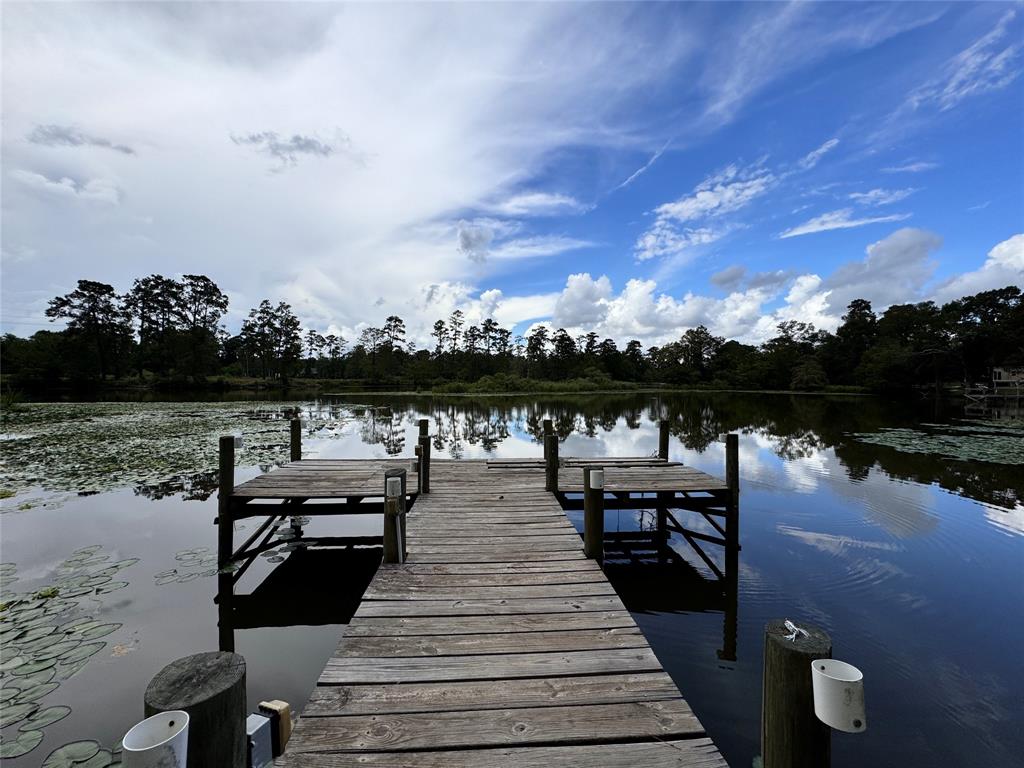 a view of a lake with outdoor seating