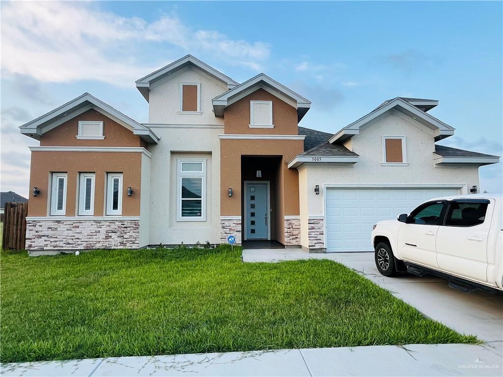 a view of house with yard