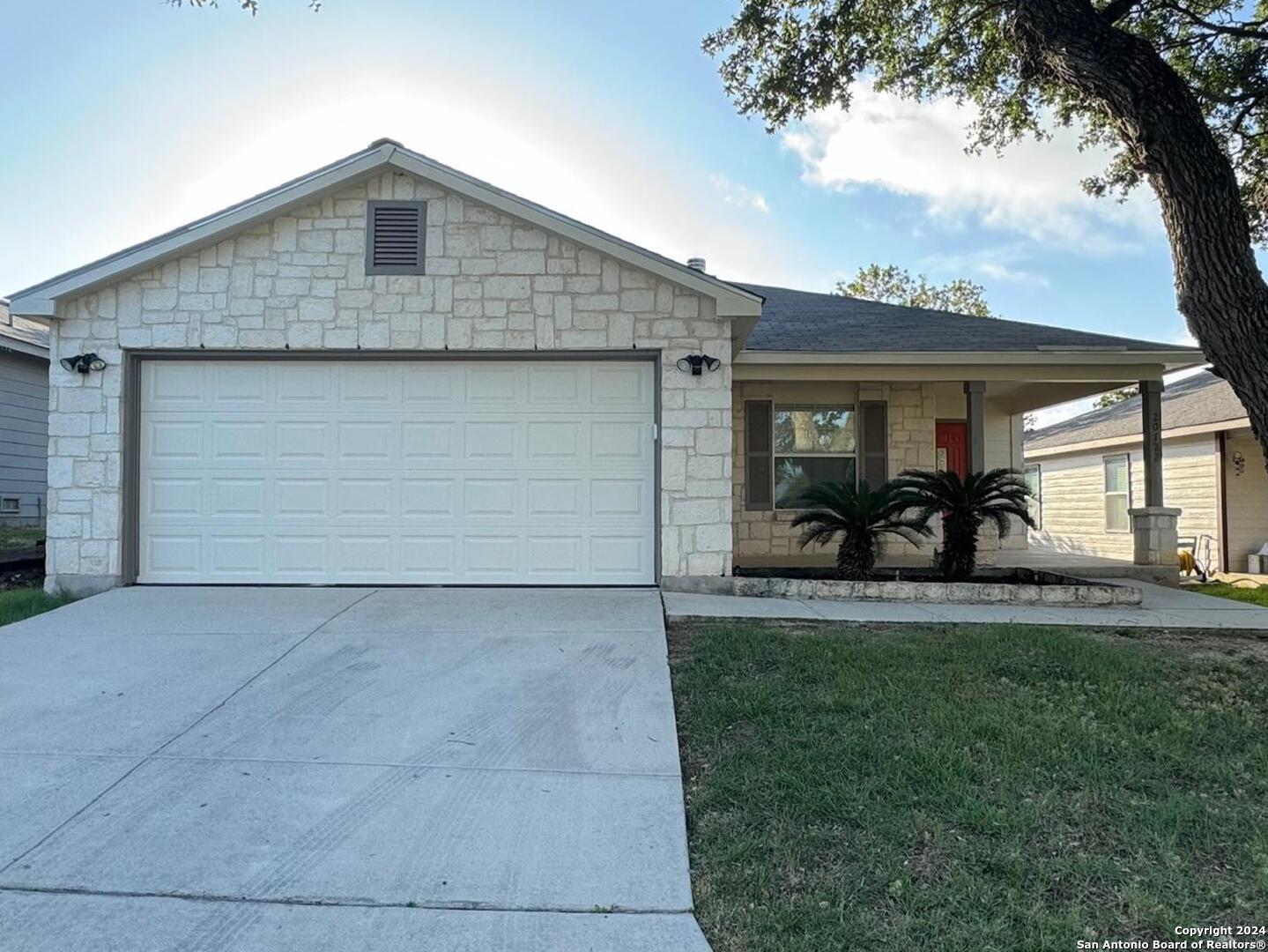 a front view of a house with patio