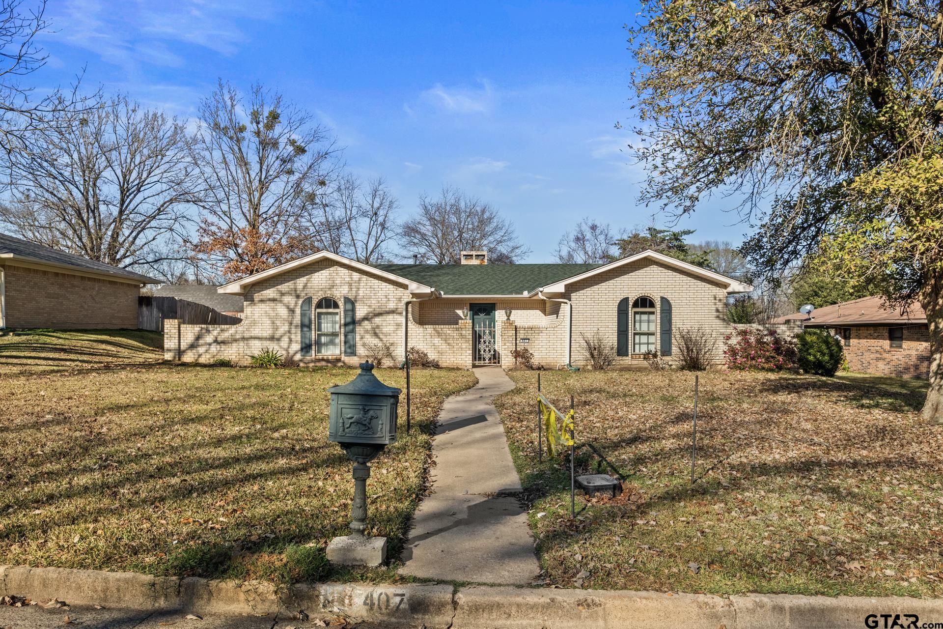 a view of multiple houses with yard