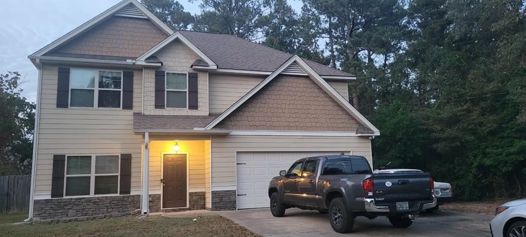 a view of a car in front of house