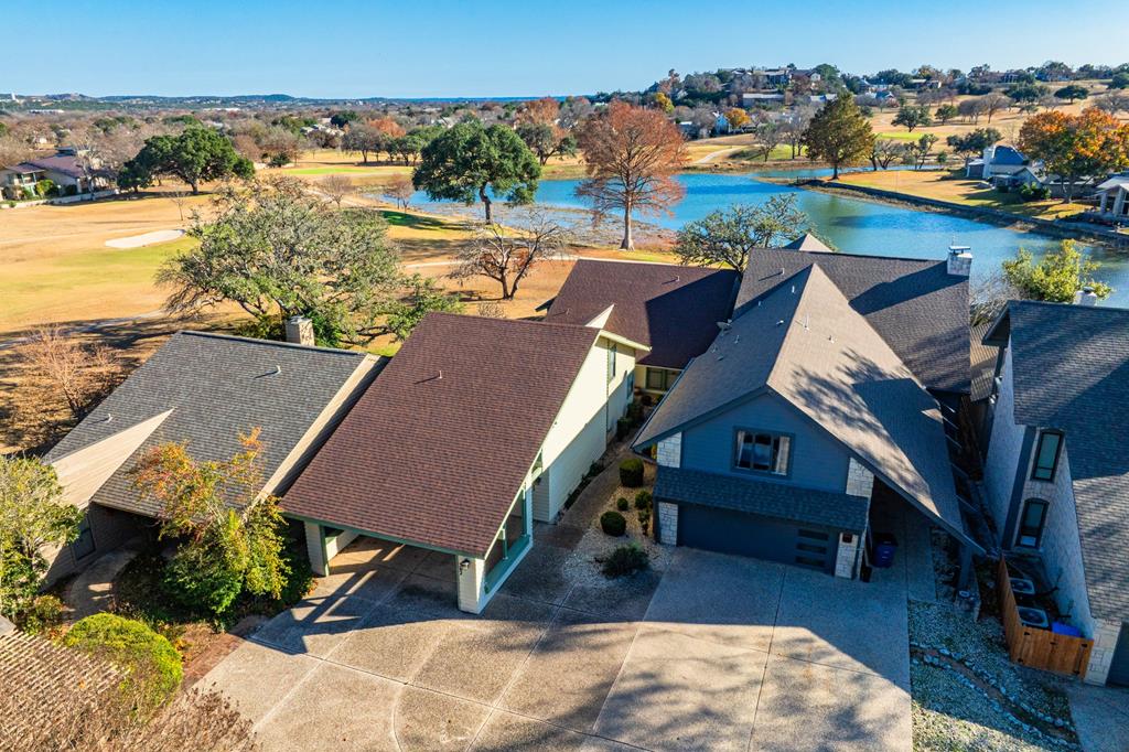 an aerial view of houses with outdoor space