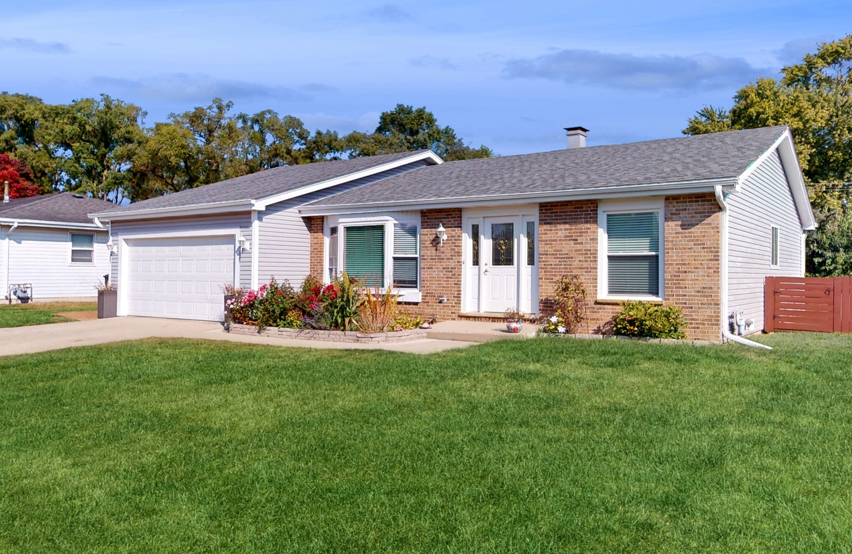 a view of a house with backyard porch and garden