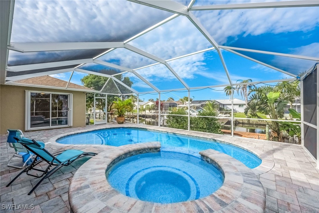 a view of a swimming pool with a patio