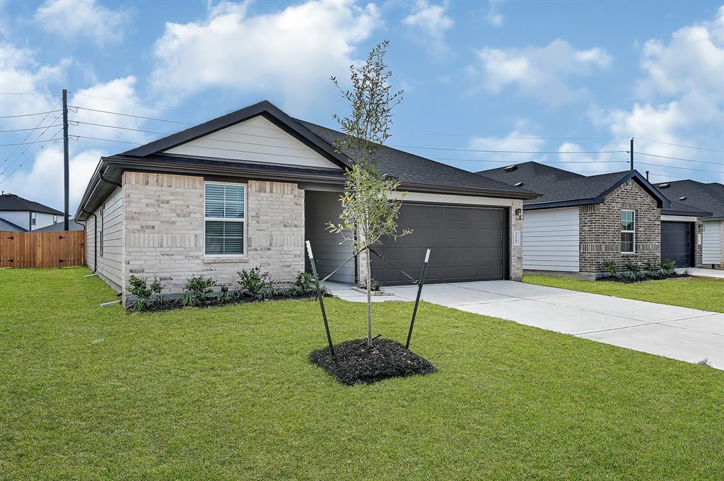 a front view of a house with a yard