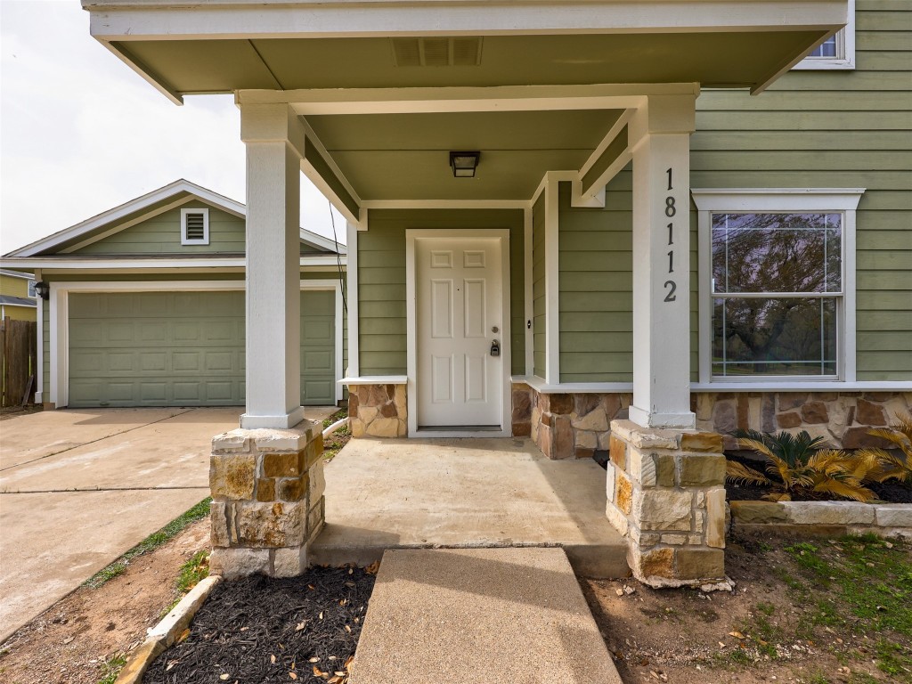 a front view of a house with outdoor seating