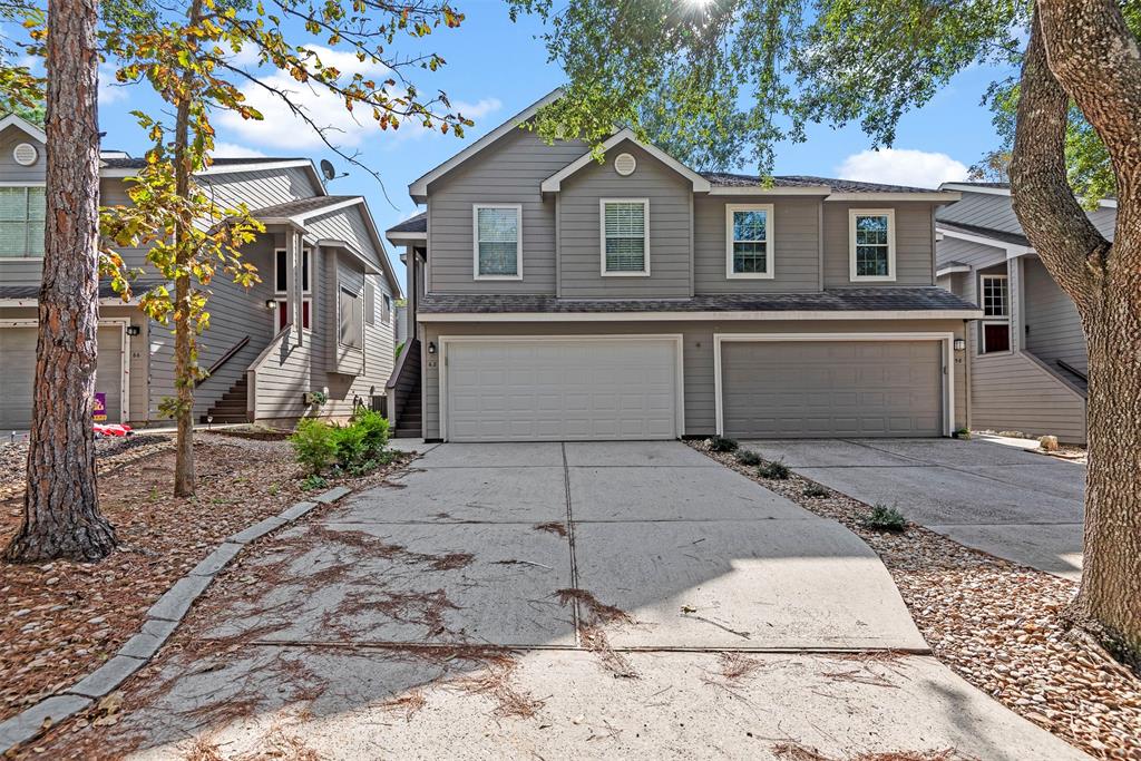 a front view of a house with garage