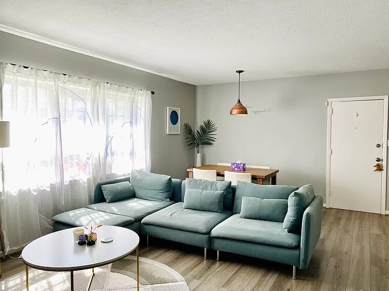 a living room with furniture and a table