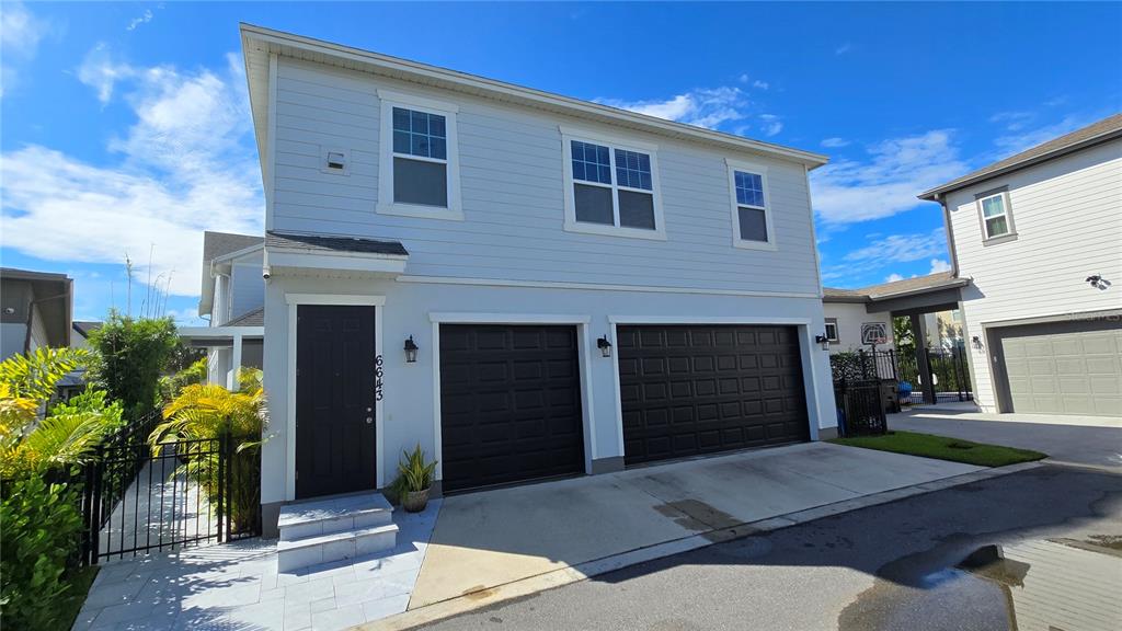 a front view of a house with a garage