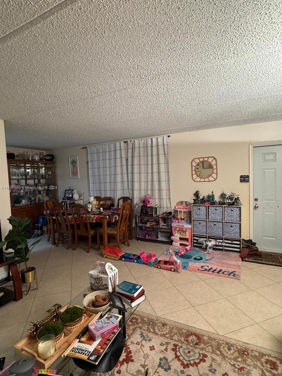 a living room with lots of gym equipment