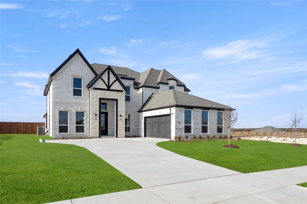 front view of a house with a yard