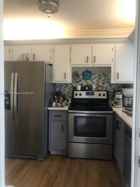 a kitchen with stainless steel appliances granite countertop a stove and a refrigerator