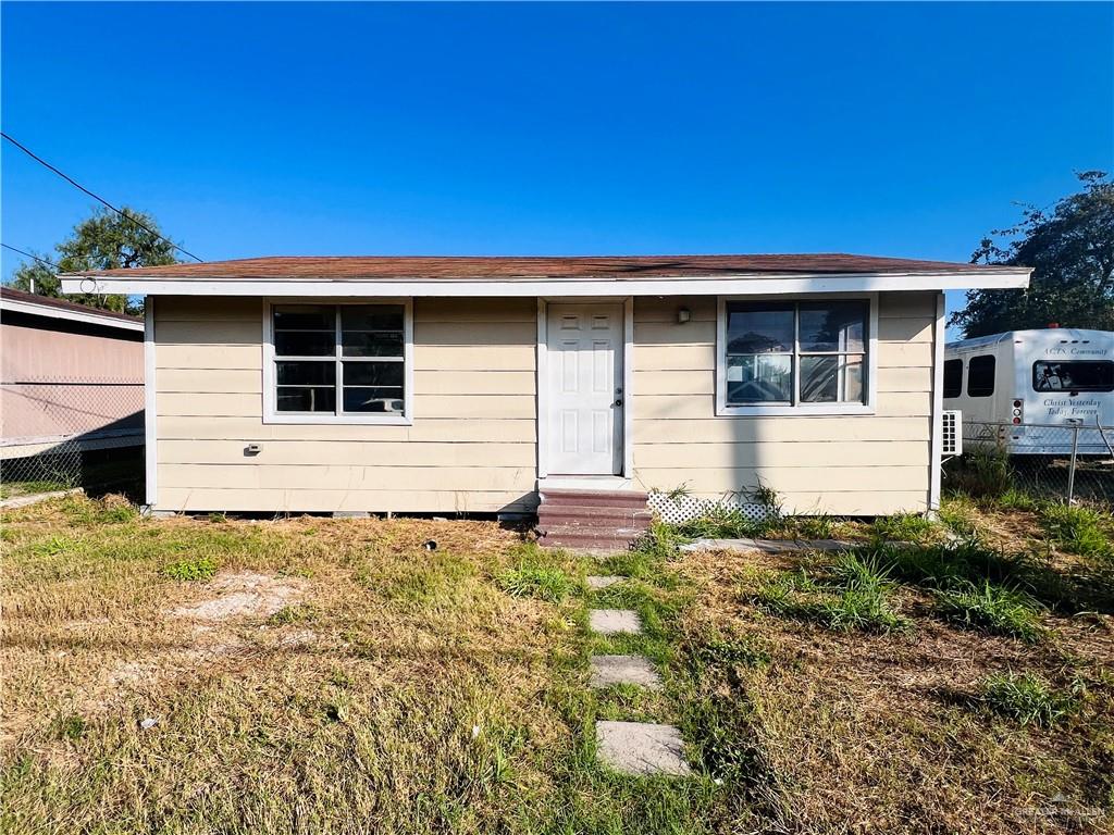 a house with yard in front of it