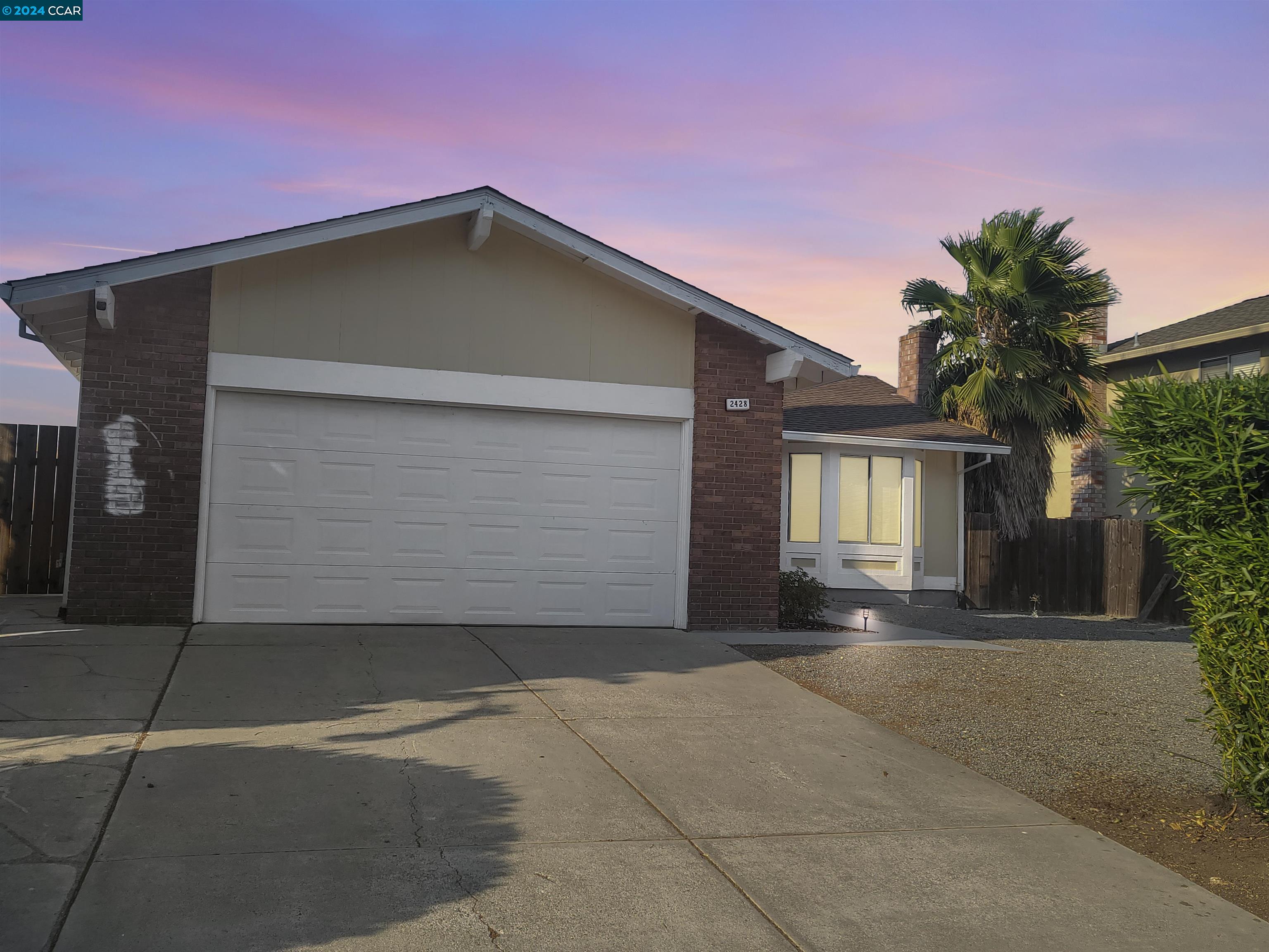 a front view of a house with a garage