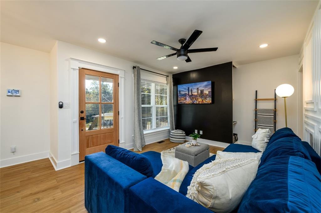 a living room with furniture and a flat screen tv