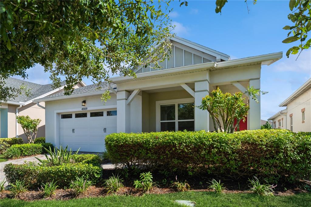 front view of a house with a garden