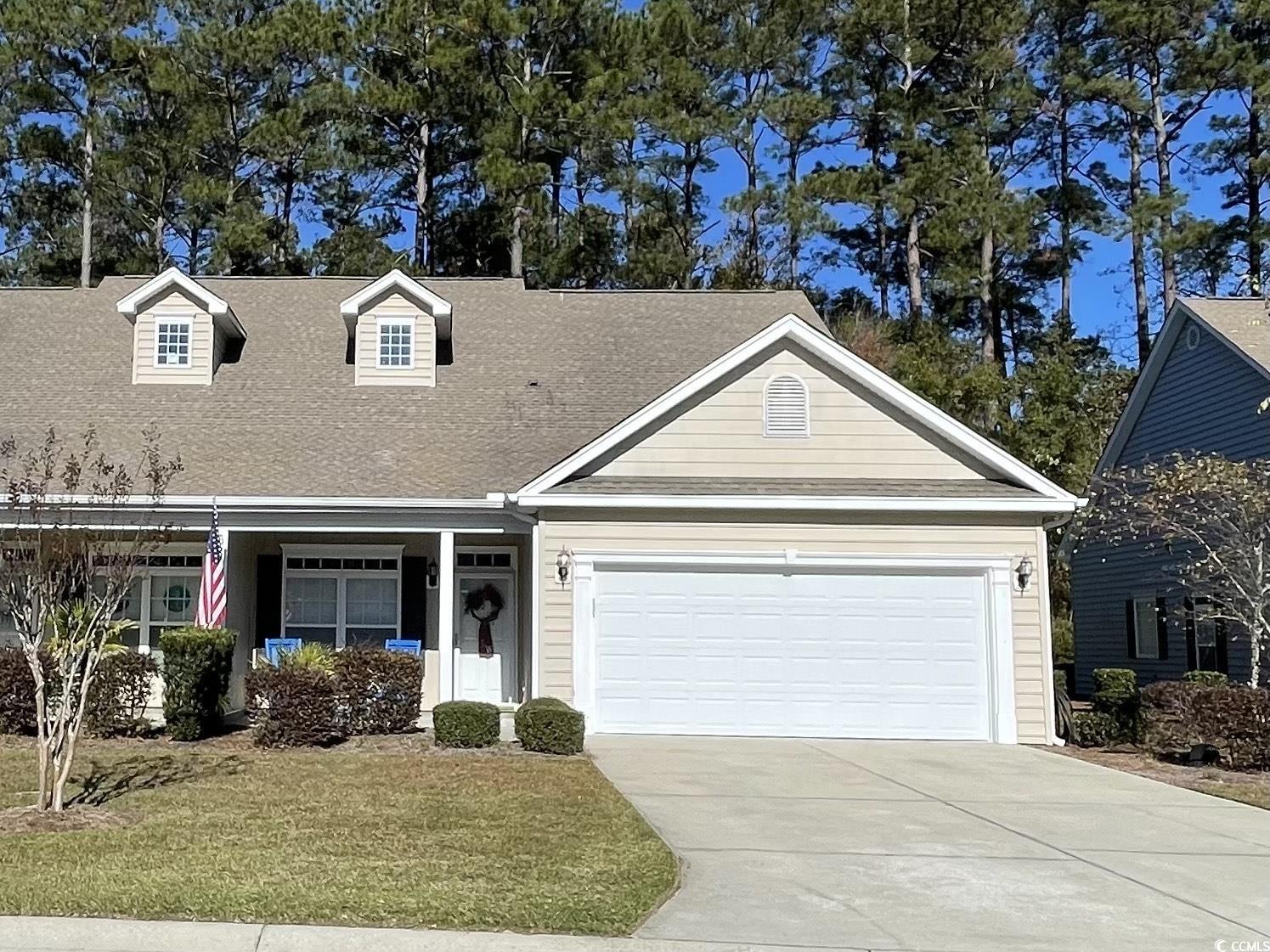 View of front of property featuring a front yard a