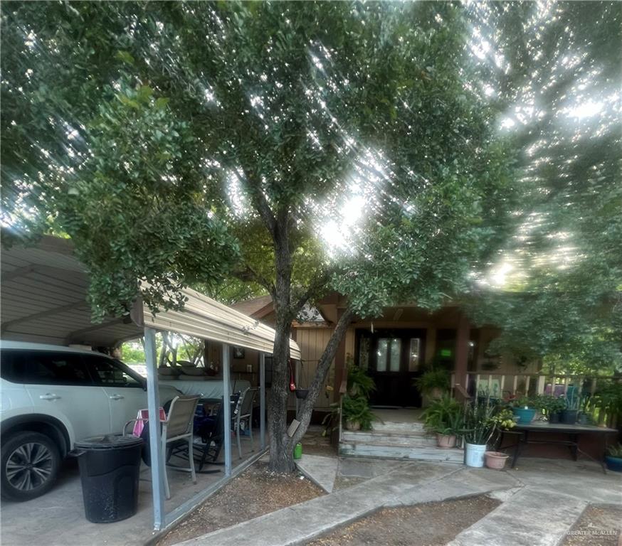 a view of a car park in front of house