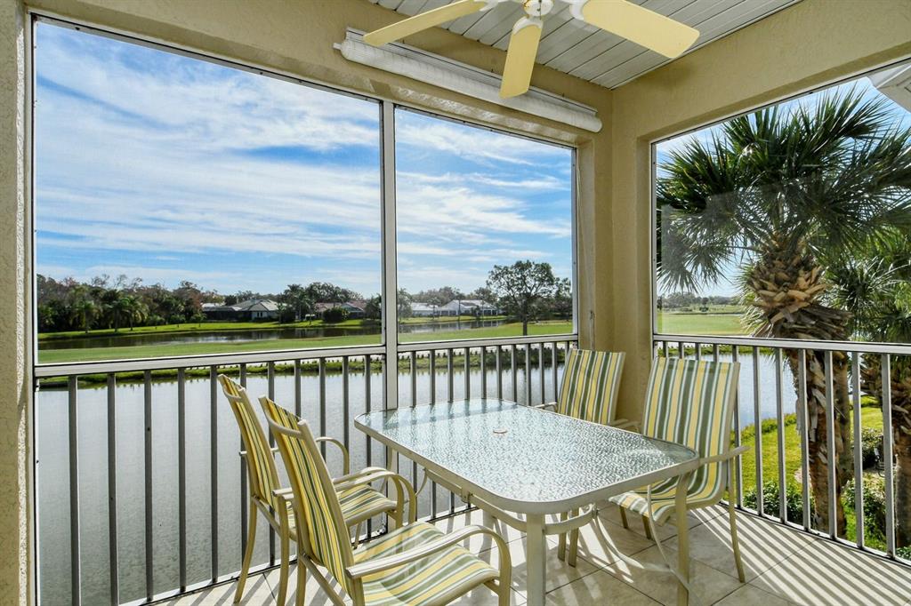 a view of a balcony with couches and wooden floor