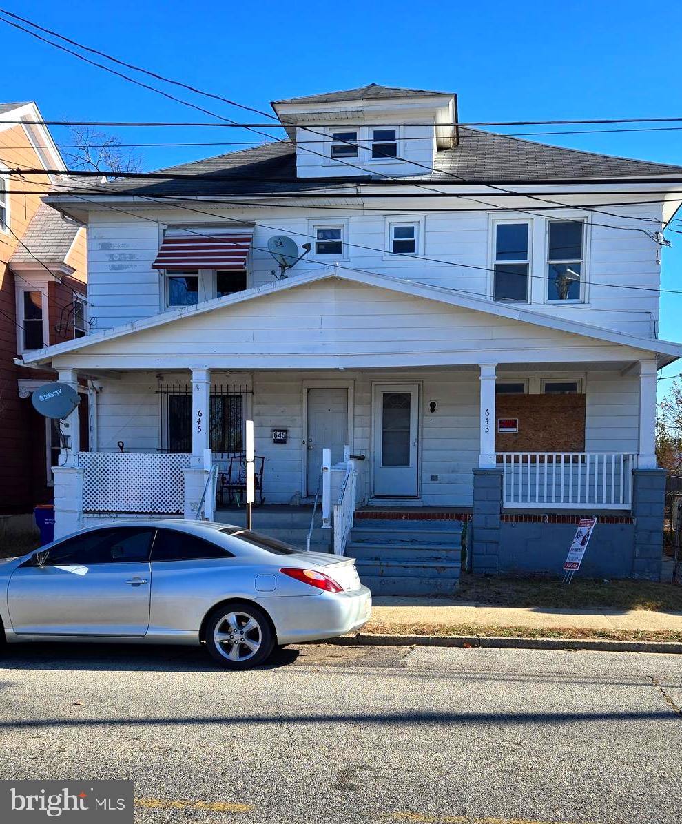 a front view of a house with parking space