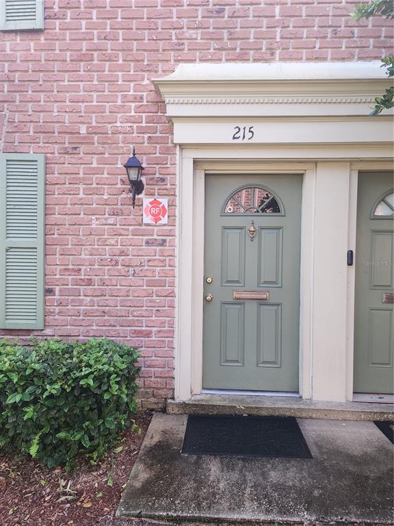 a front view of a house with white door