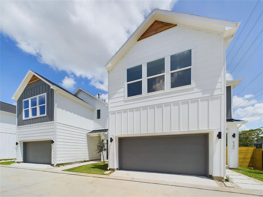 a front view of a house with a garage