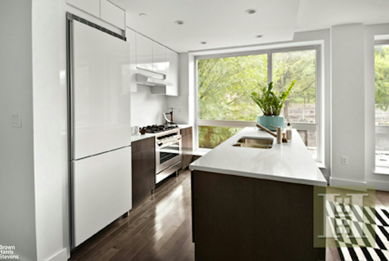 a kitchen with appliances cabinets and a sink