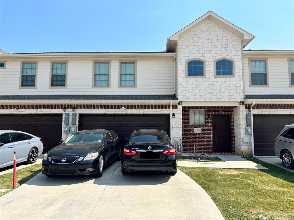 a view of a car parked in front of a house