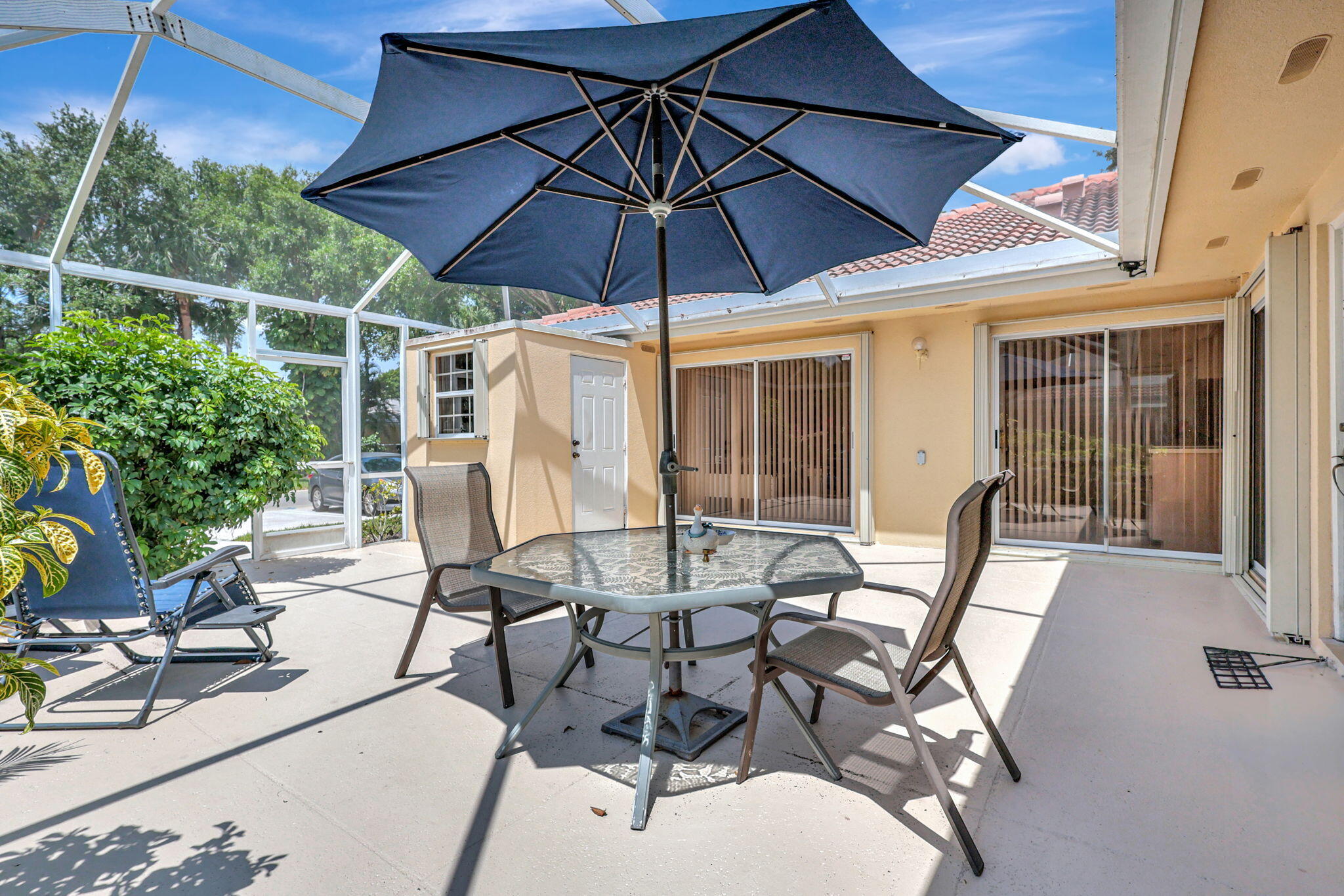 a patio with a patio table and chairs