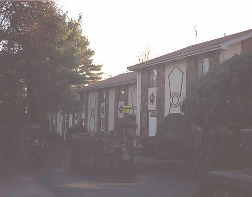 a view of a house with backyard