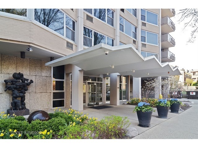 a view of a building with potted plants