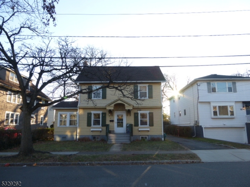 front view of a house with a street