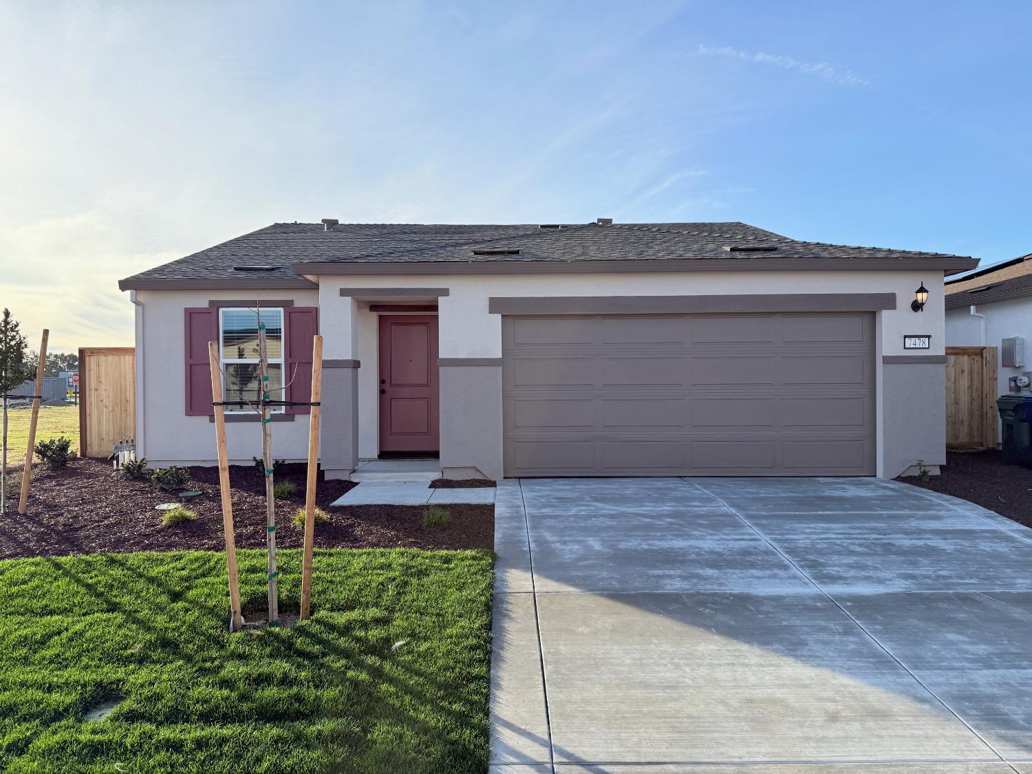 front view of a house with a bench