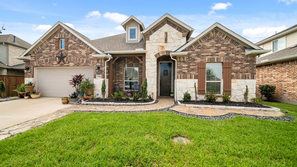 front view of a house with a yard