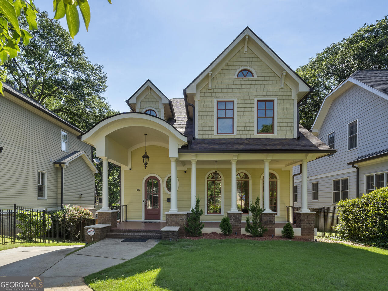 a front view of a house with garden