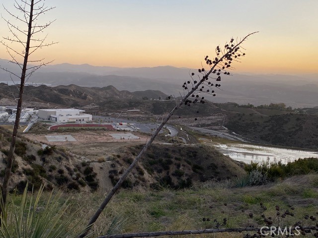 a view of a town with mountains in the background