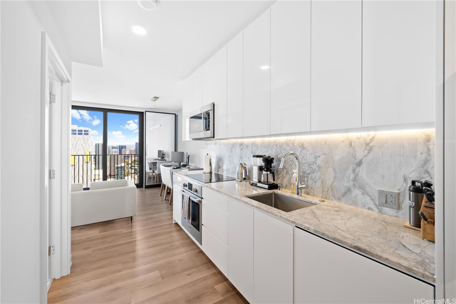 a kitchen with a sink stove and cabinets