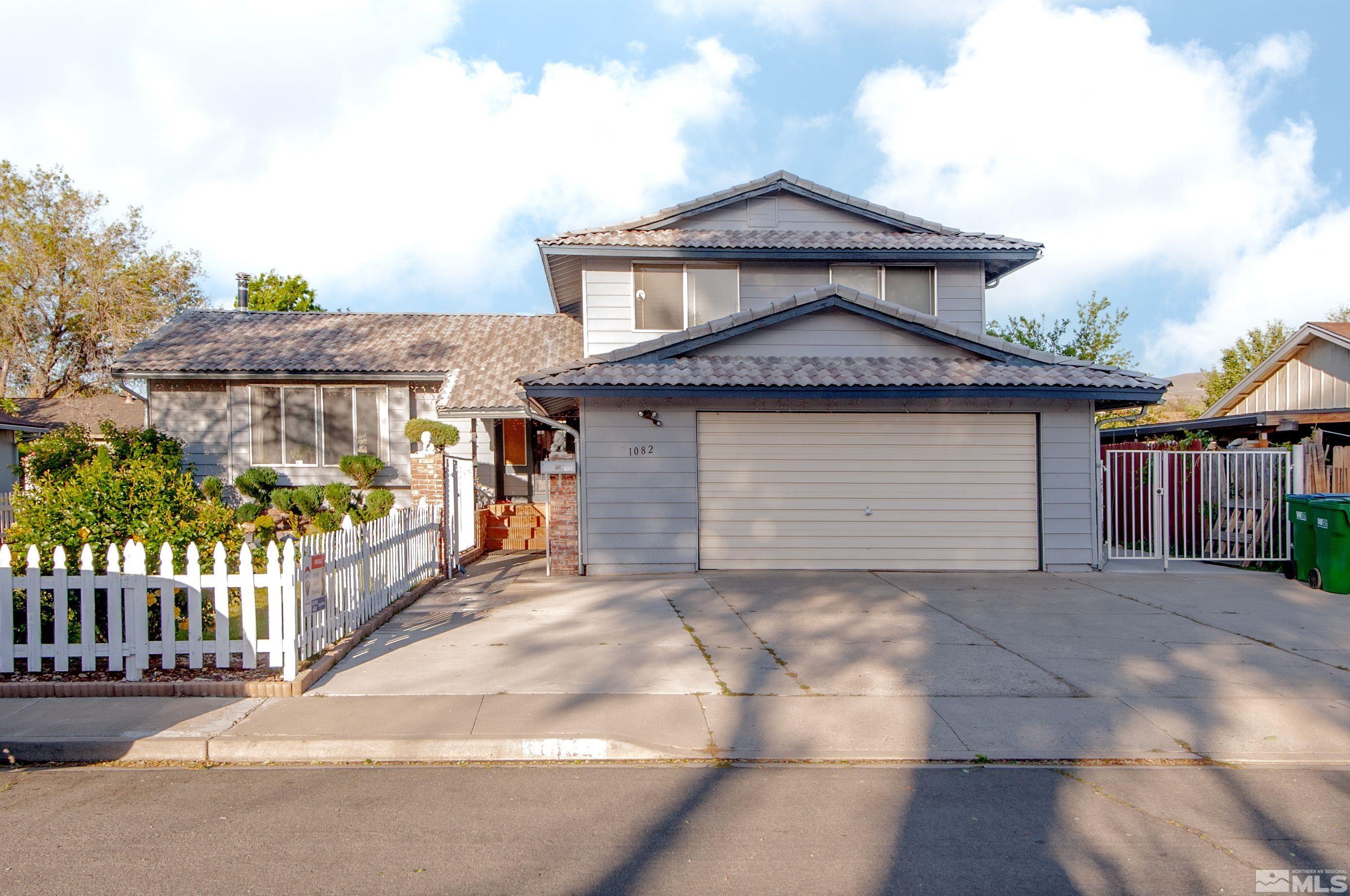 a front view of a house with a garage