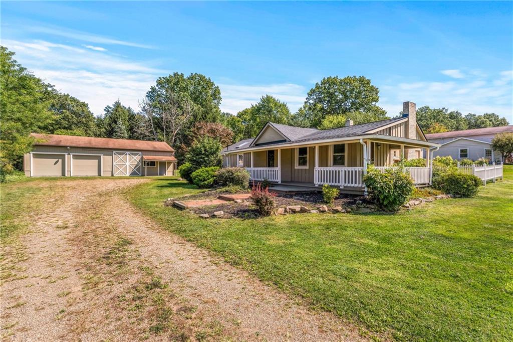 Enjoy a rural setting on 1.55 acres in Sharpsville. The home is move in ready.  This 2 bedroom, 2 bath home has a large primary suite with laundry and an open concept with a stunning kitchen with a large island for entertaining.  The home has original hardwoods, fireplace and an appliance package.  it has a well and public sewer