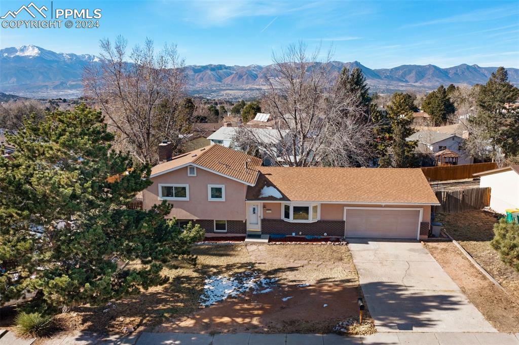 a aerial view of a house with a yard