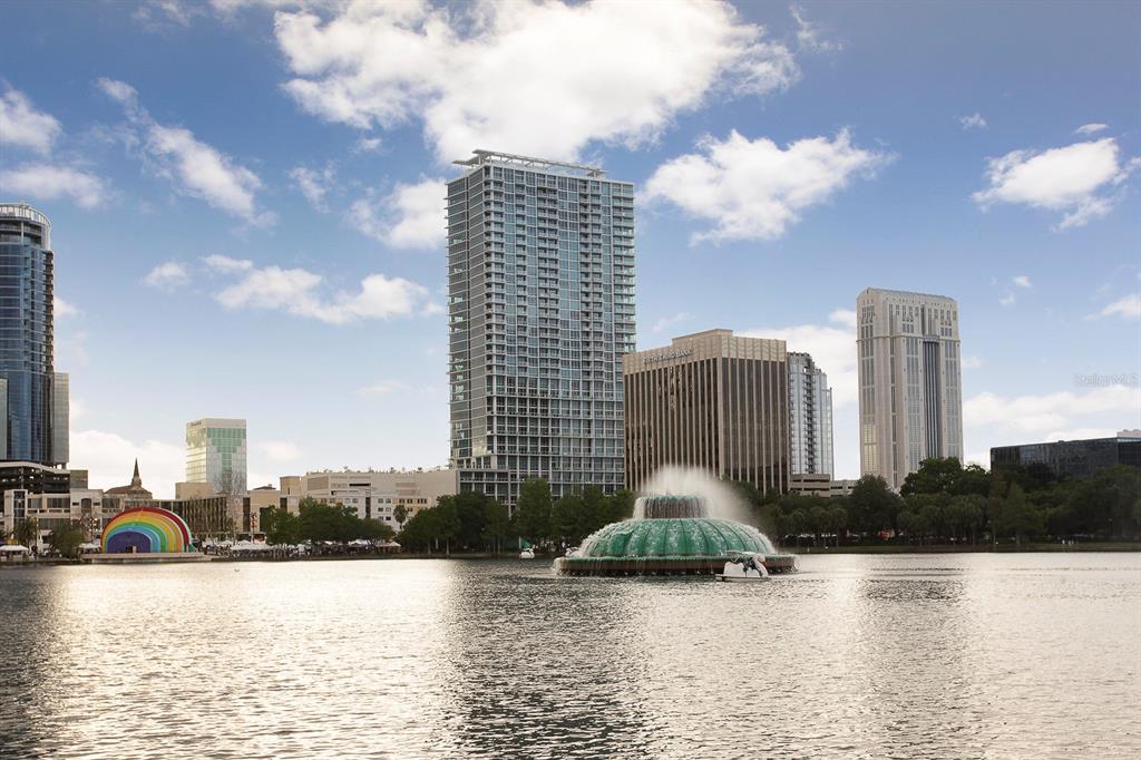 a view of a lake with tall buildings