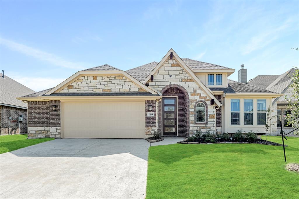 front view of a house with a yard