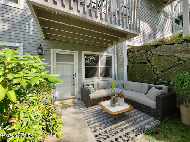 a view of a chairs and table in the patio