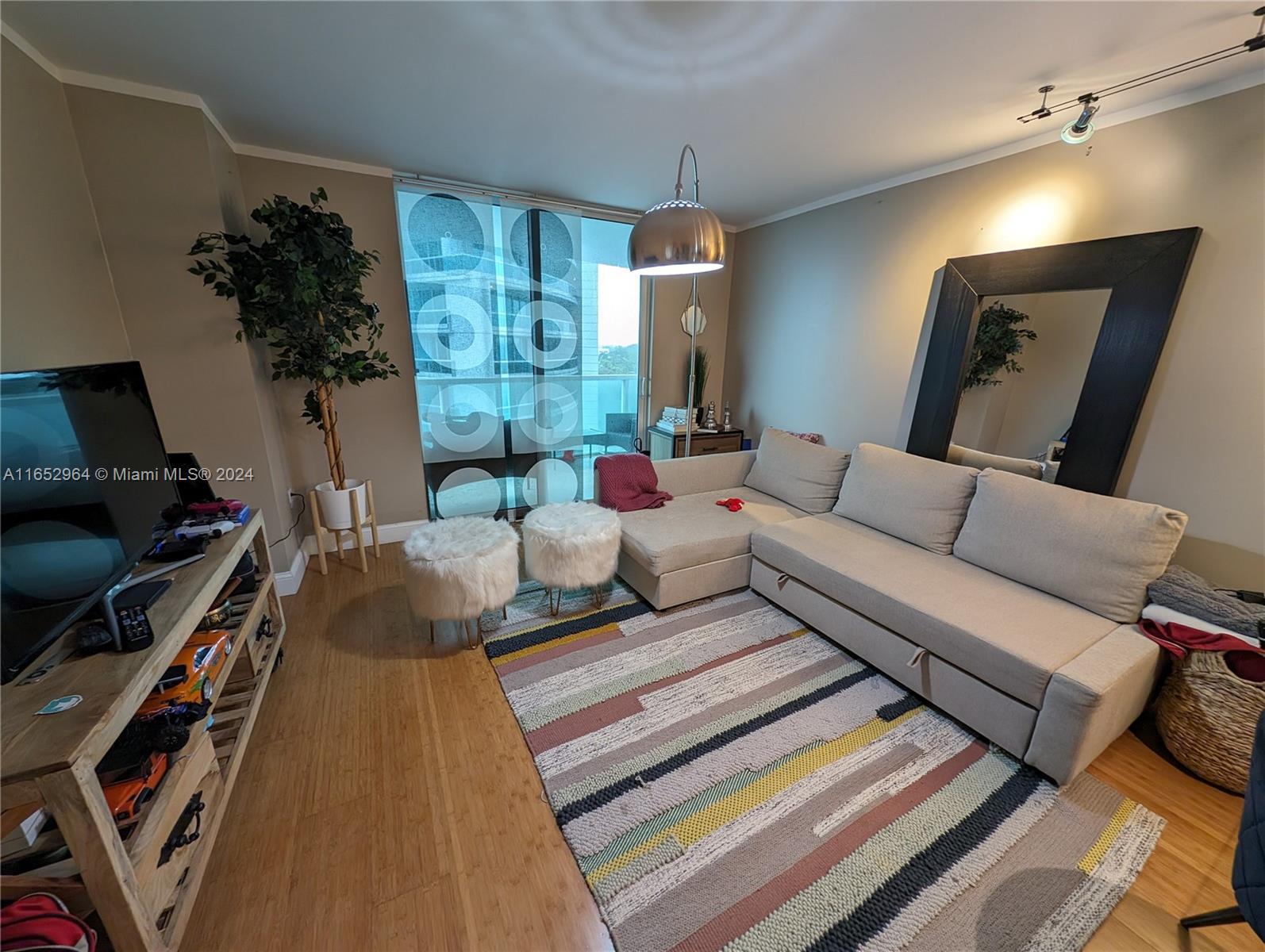 a living room with furniture fireplace and a flat screen tv