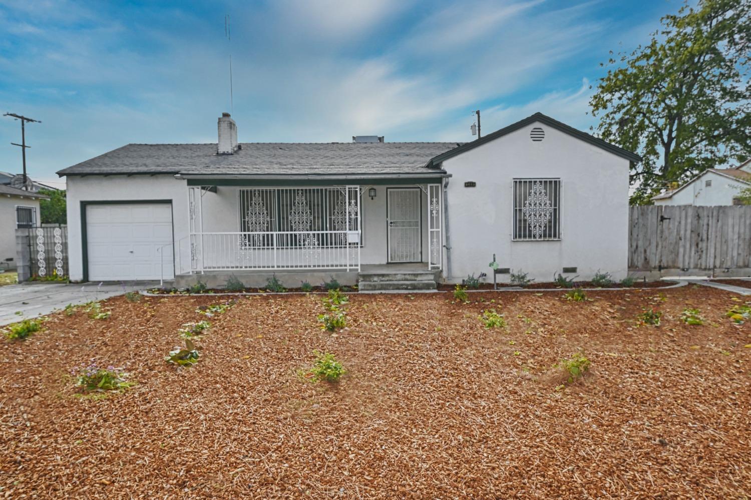 a house view with wooden fence