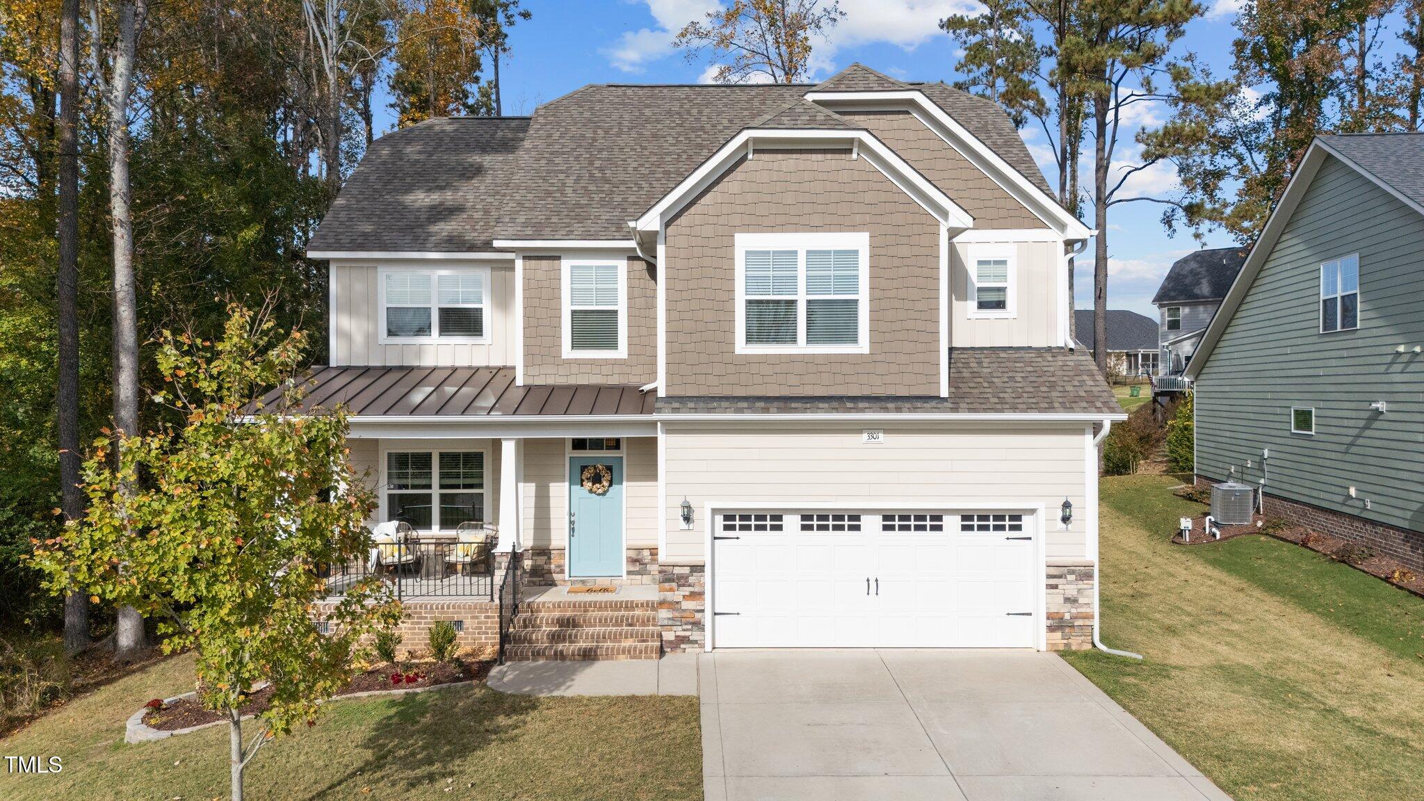 front view of a house with a yard