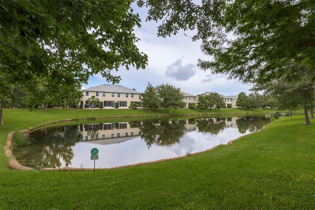 a view of a lake with houses in the background