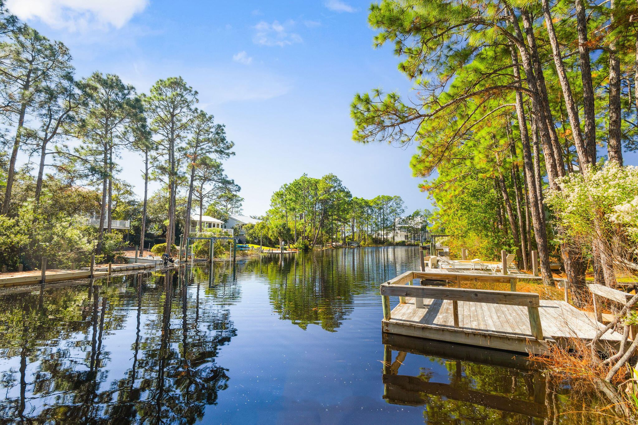 a view of a lake with houses in the background